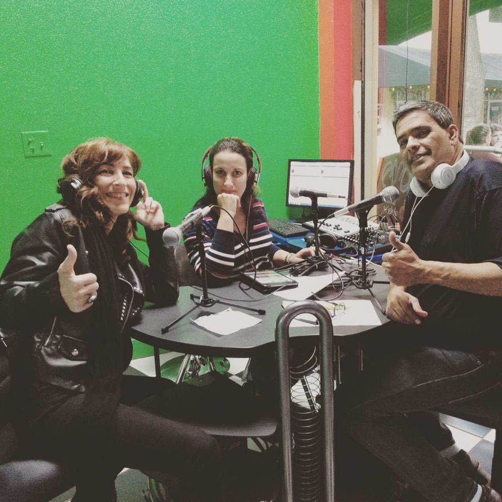 A photo of founder Lia being interviewed on a radio show.